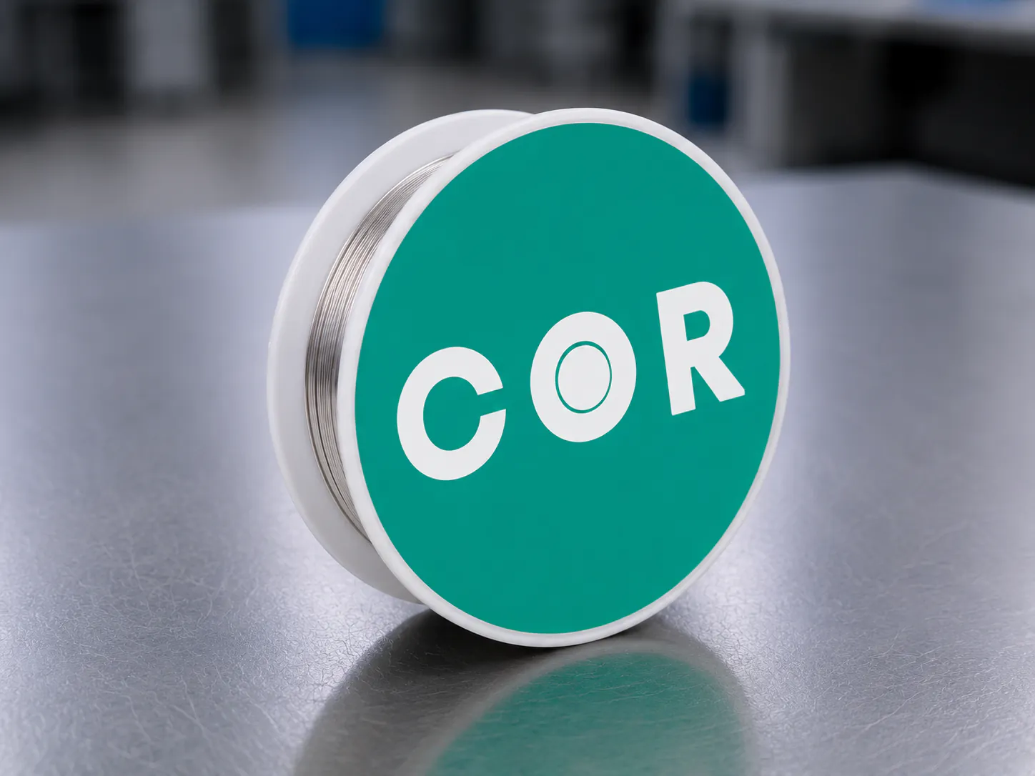 Spool of specialty optical fiber on a laboratory bench